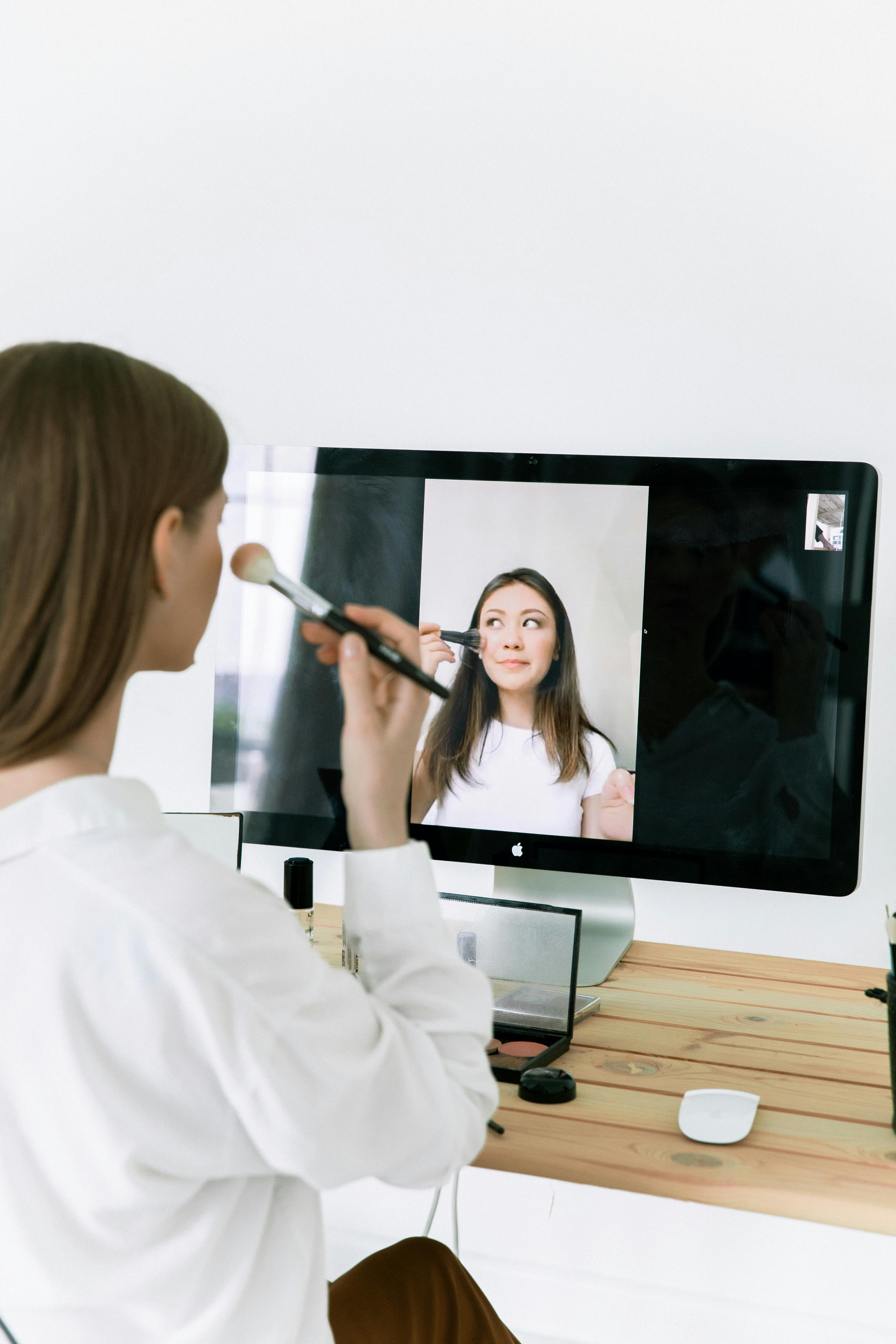 photo of woman holding make up brush