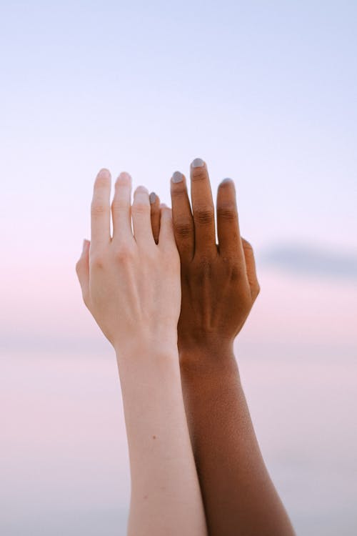 Close-Up Photo Of People Hands