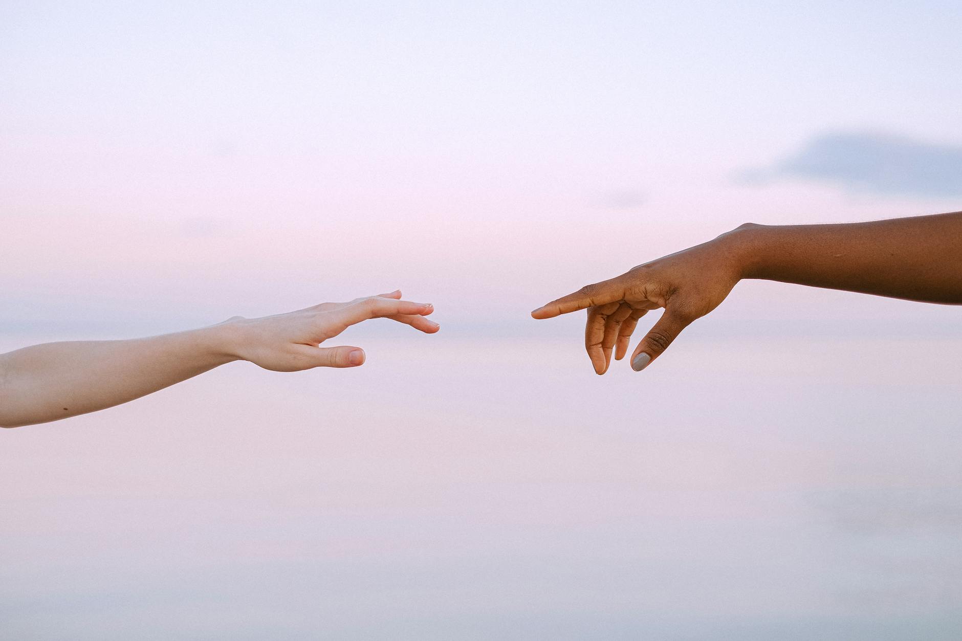 Image of People Reaching Each Other's Hands