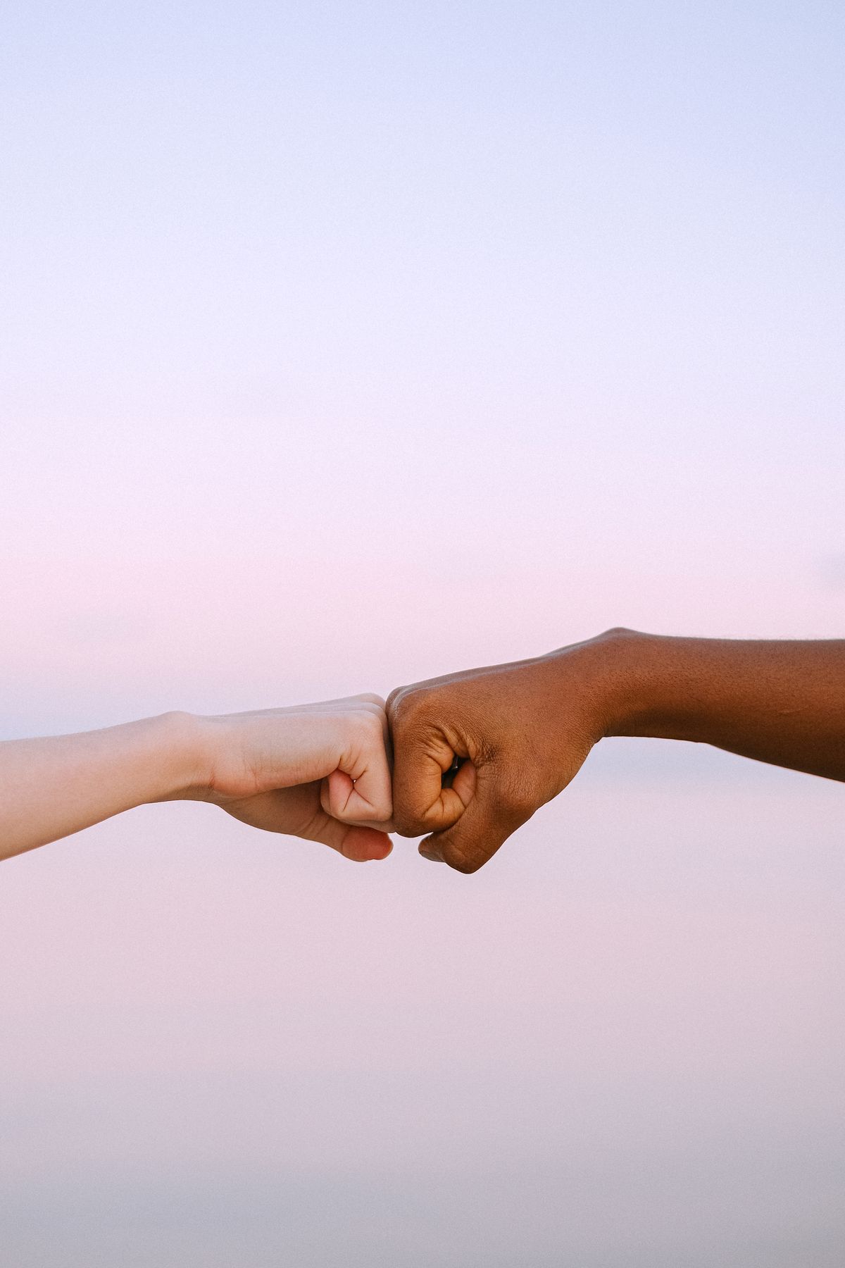 Two partners fist bumping in agreement
