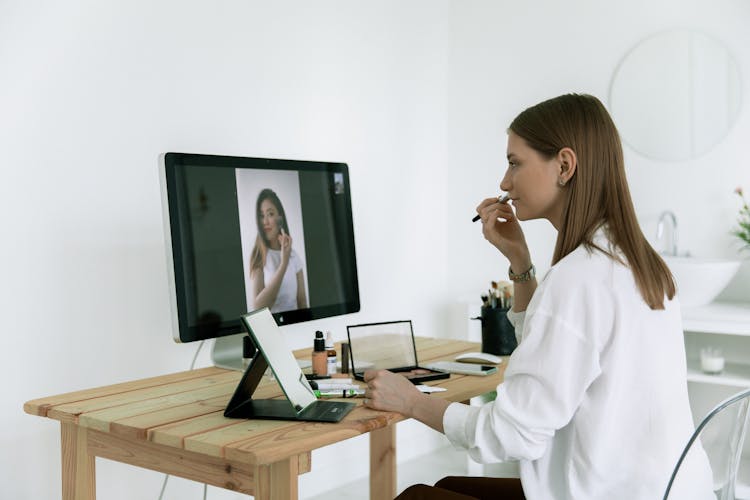 Woman Watching A Makeup Tutorial