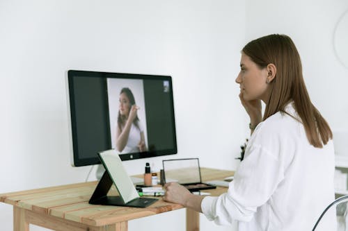 Photo Of Woman Looking On The Screen 