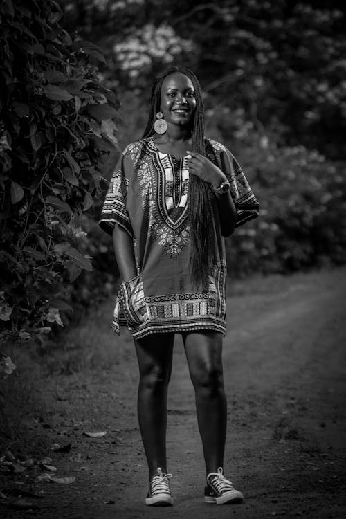 Free Photo Of Woman Standing On Dirt Road Stock Photo