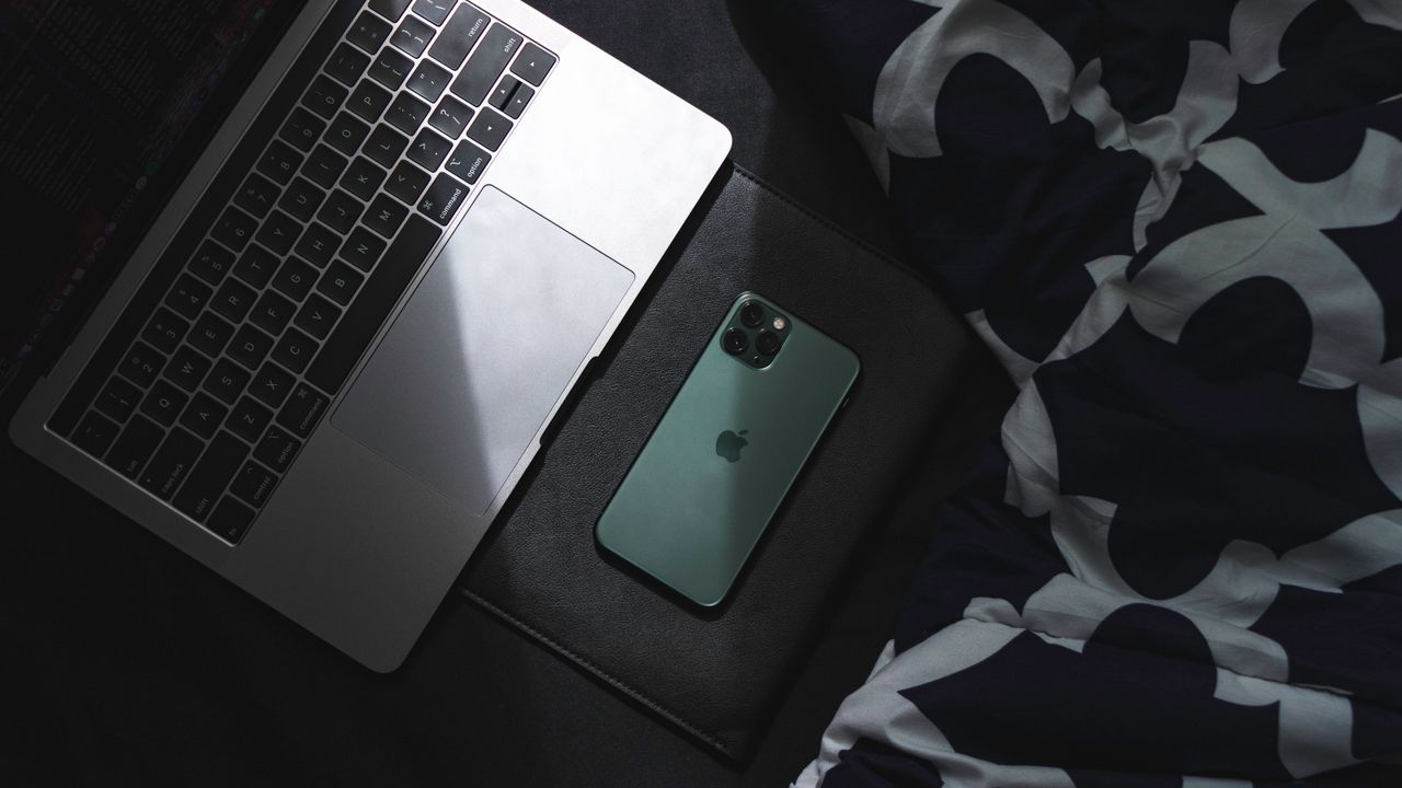 a sleek laptop and smartphone resting together ideal for technology an