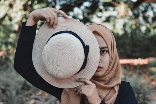 Free Photo Of Woman Holding Fedora Hat  Stock Photo