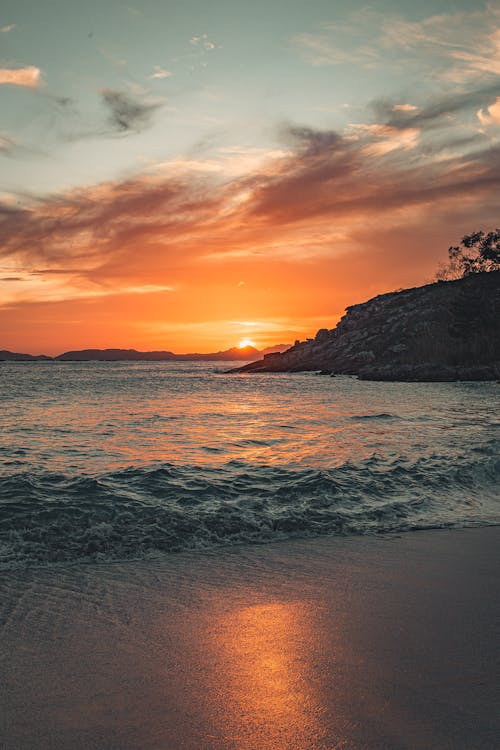 Foto profissional grátis de à beira-mar, alvorecer, areia