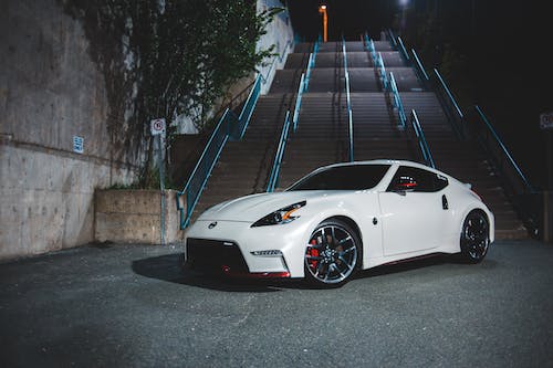 Photo Of Sports Car Near Staircase