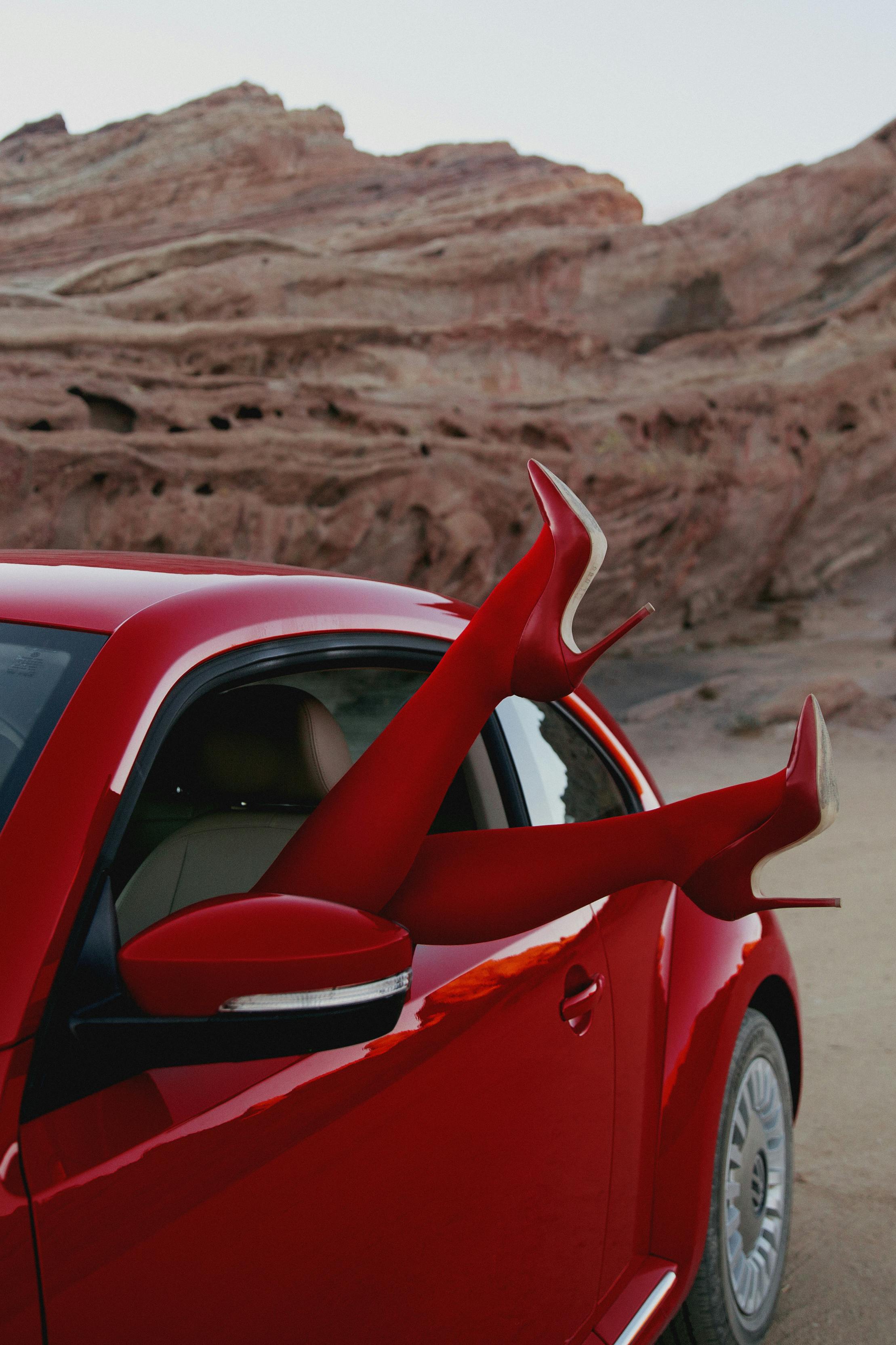 photo of person inside red car