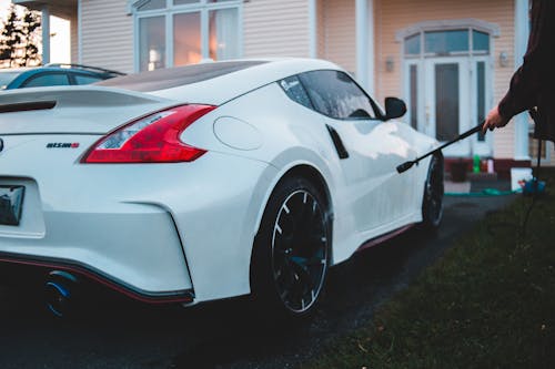 Close-Up Photo Of White Sports Car