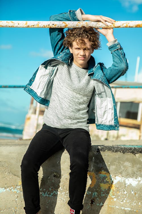 Free Photo Of Man Sitting On Concrete Stock Photo