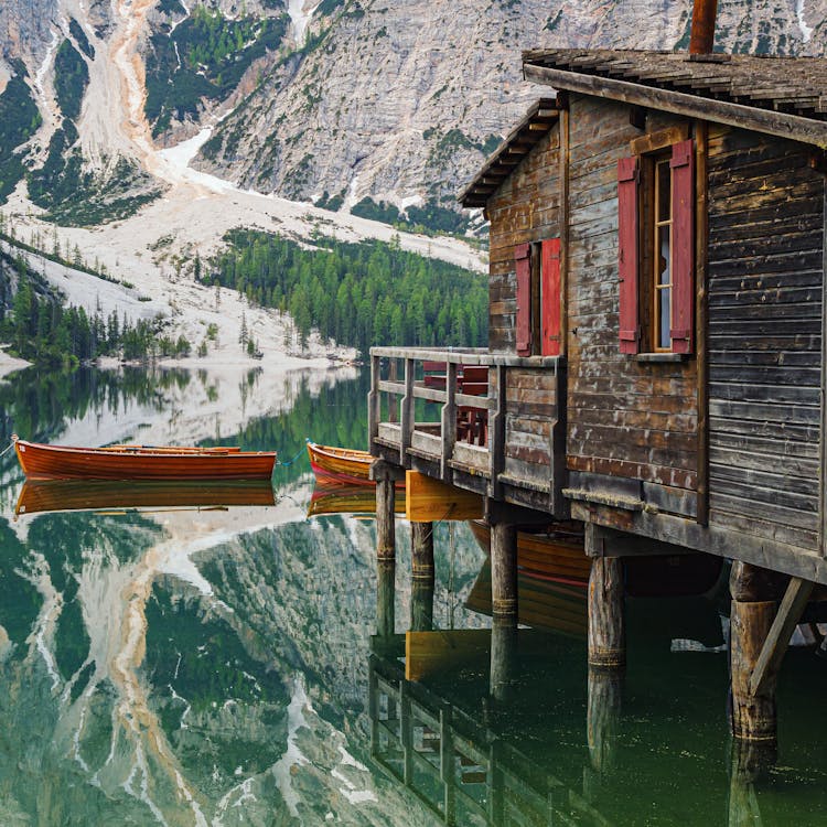 Brown Wooden House On Lake Prags