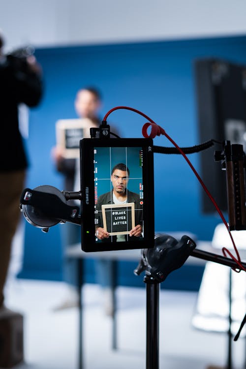 Photoshoot of a Man Holding a Sign