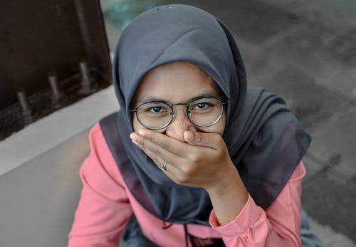 Woman Wearing Hijab Covering Her Mouth