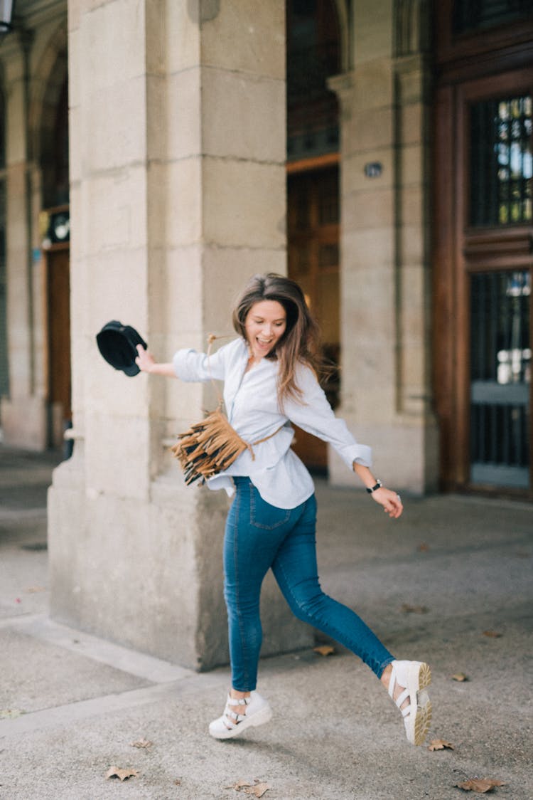 Happy Woman Jumping With Her Mouth Opened