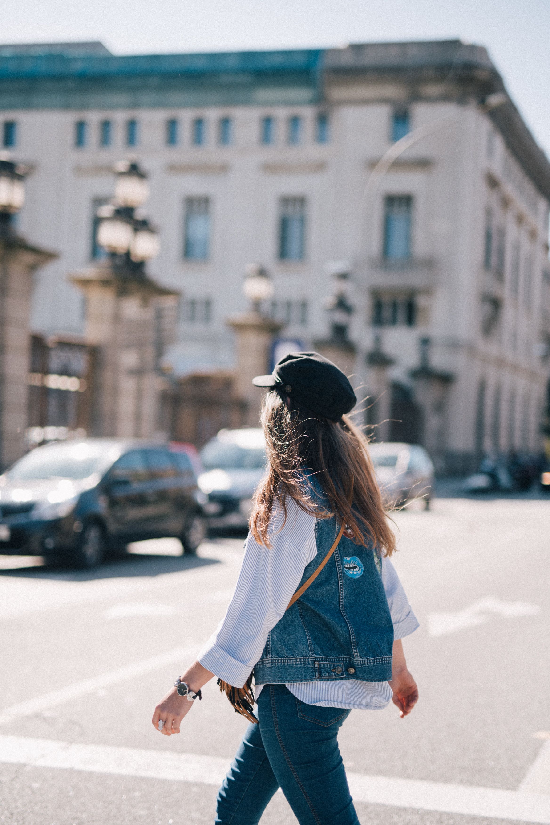 Woman in Denim Jacket and Jeans Crossing the Road · Free Stock Photo