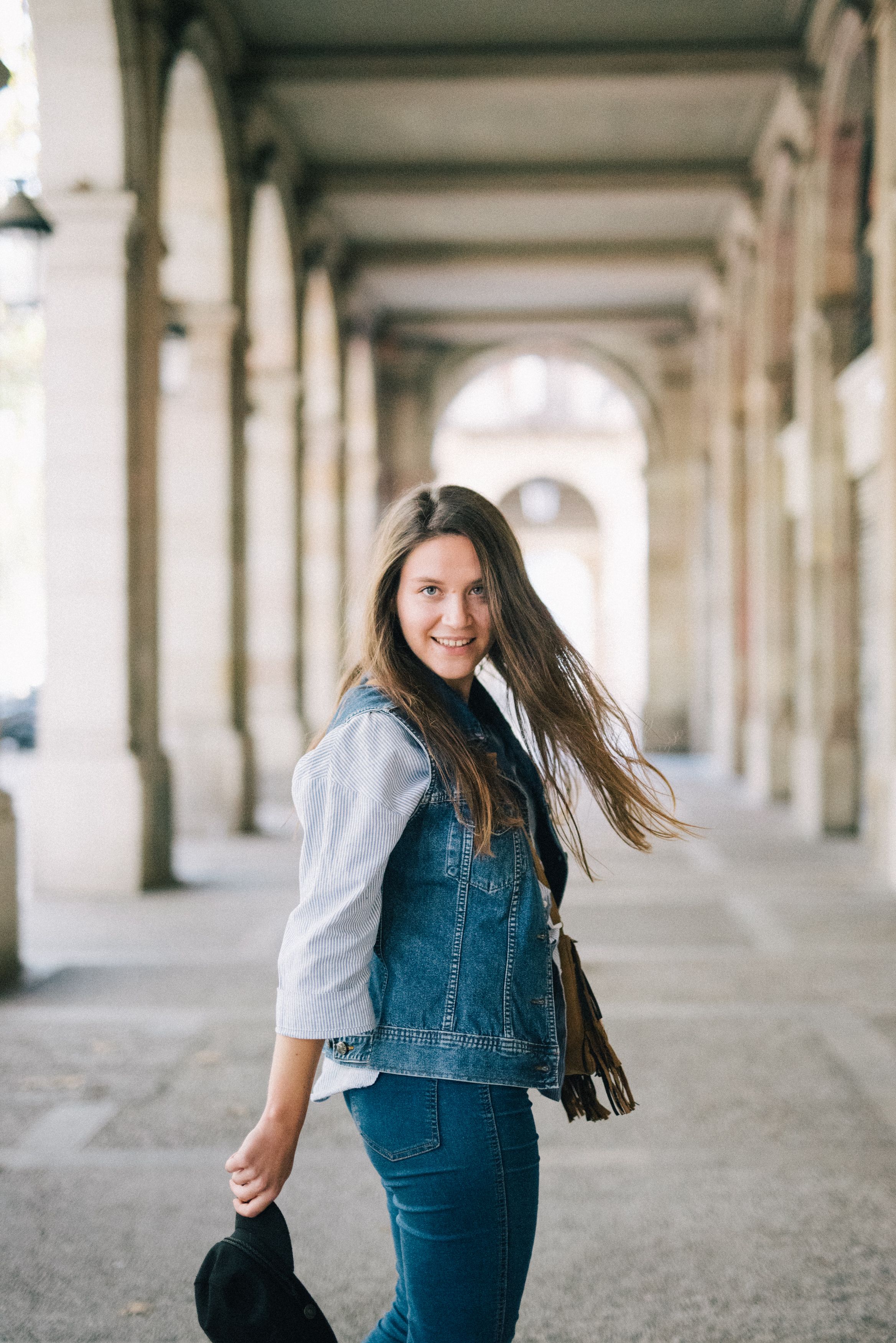 Woman in Blue Denim Jacket Standing on Sidewalk · Free Stock Photo