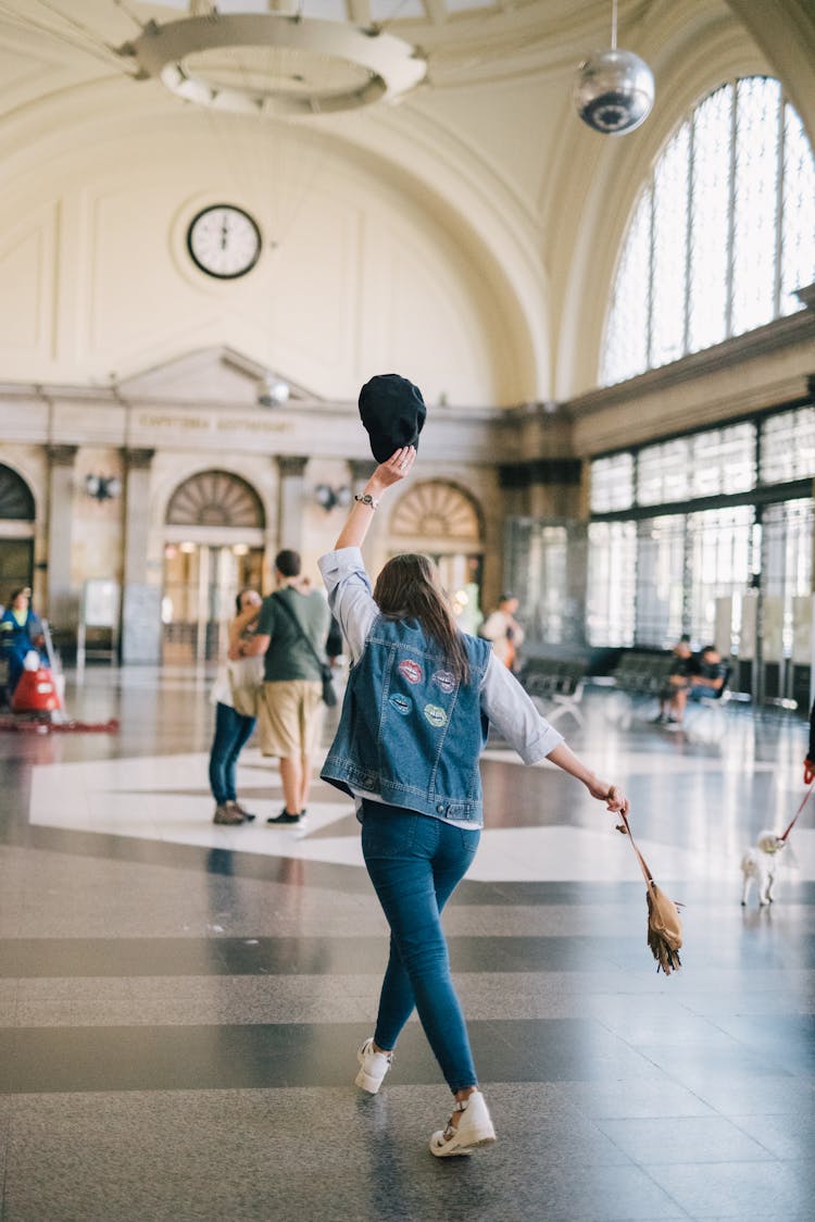 Woman In Denim Clothes Walking On A Hallway