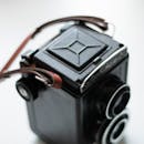 Black Camera with a Leather Strap