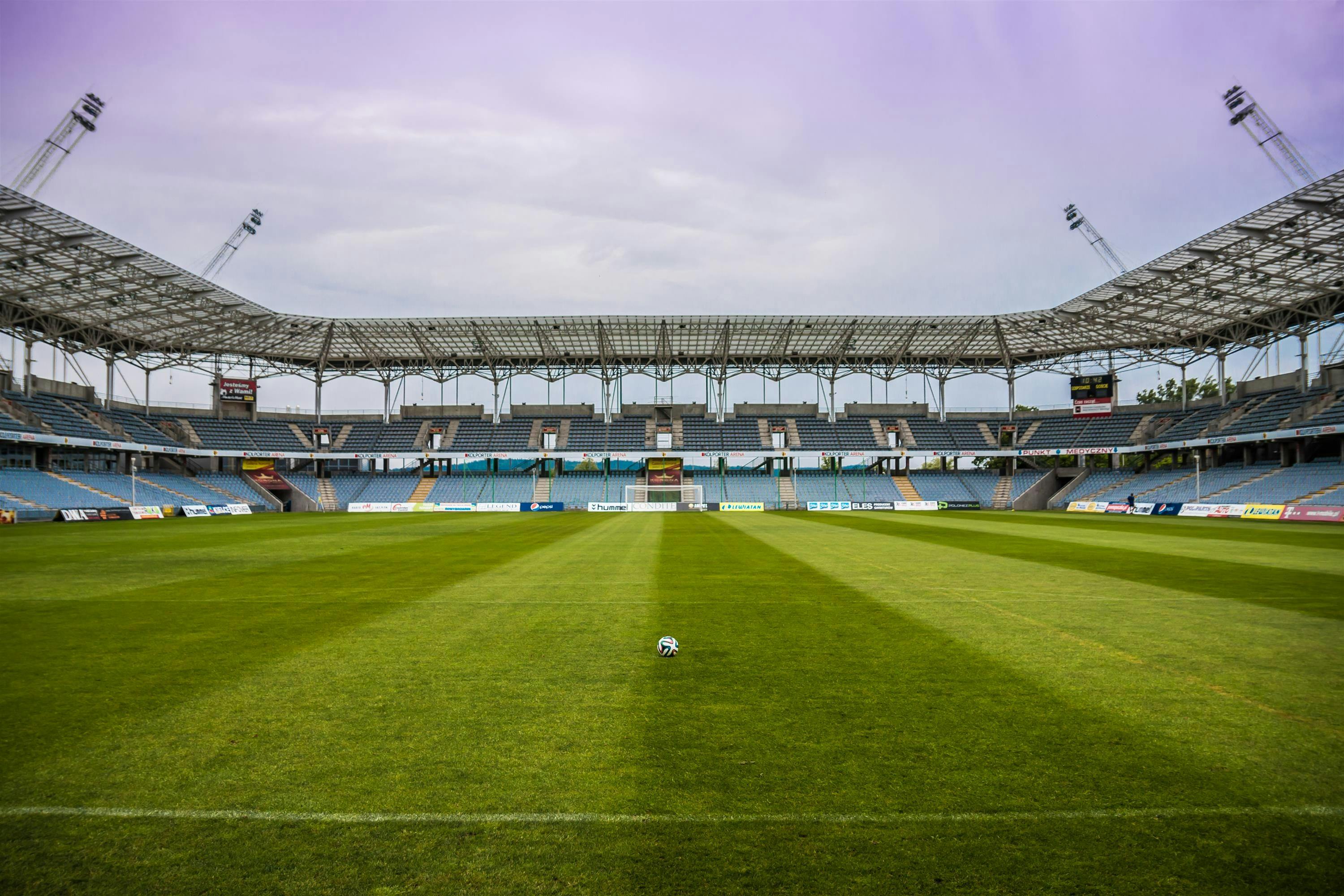 soccerball on wide green grass field