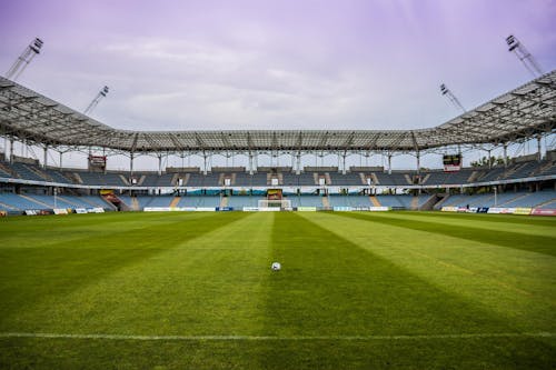 Soccerball on Wide Green Grass Field