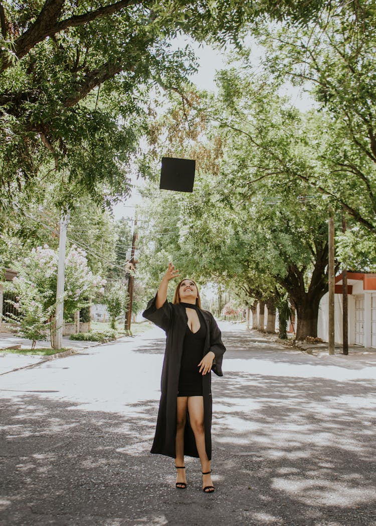 Positive Lady Tossing Cap In Air