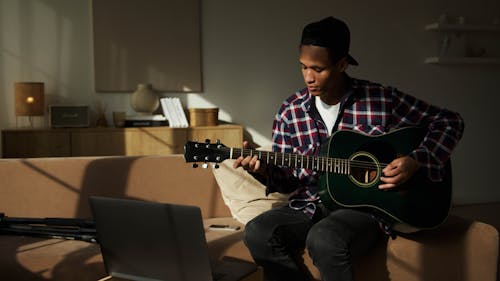 Man Playing An  Acoustic Guitar