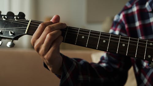 Free Person Playing Guitar In Close Up Photography Stock Photo