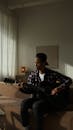 Man Playing a Guitar