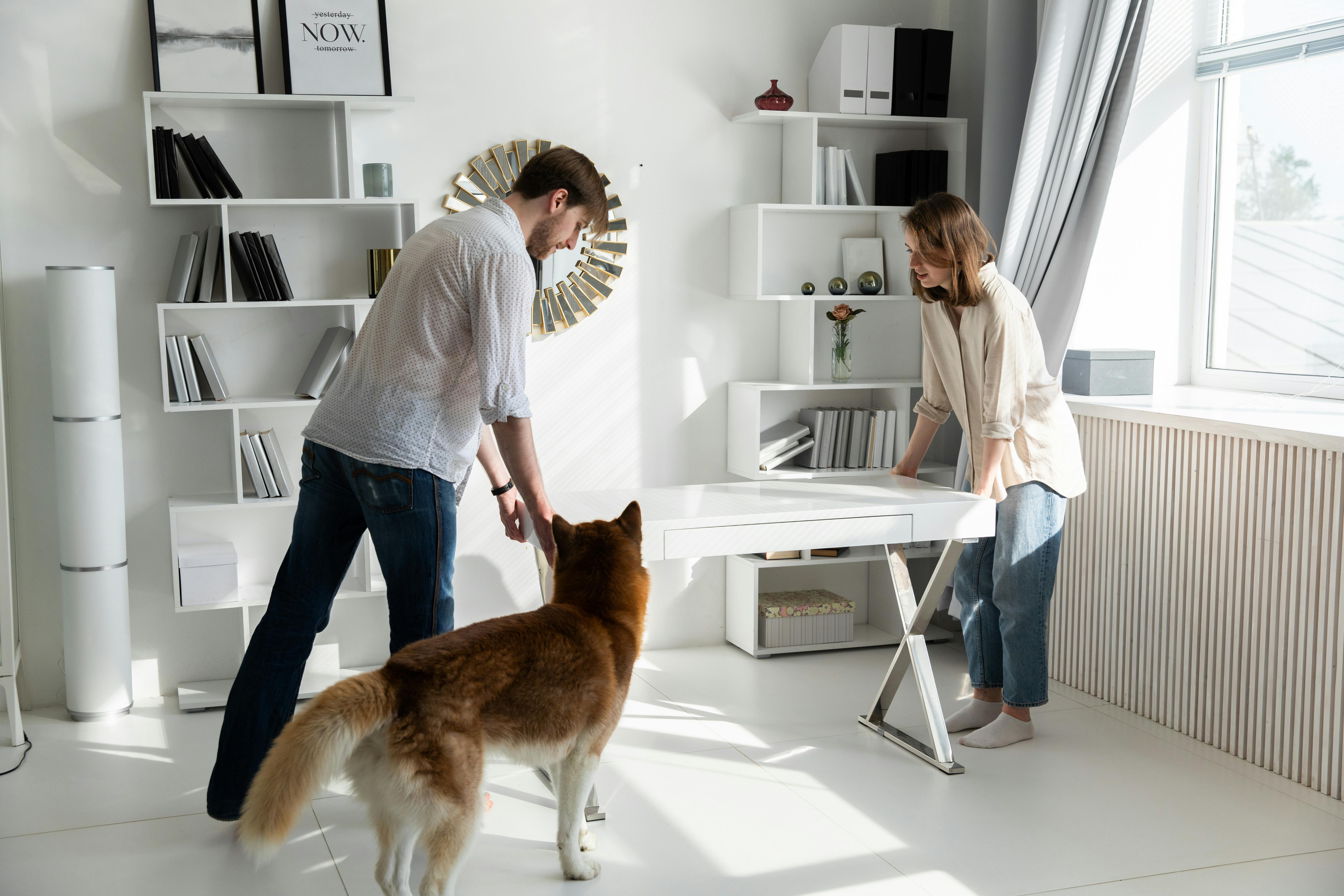 a couple moving a desk