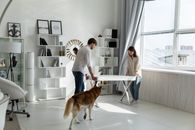Man in Gray Dress Shirt Standing Beside Woman in White Long Sleeve Shirt