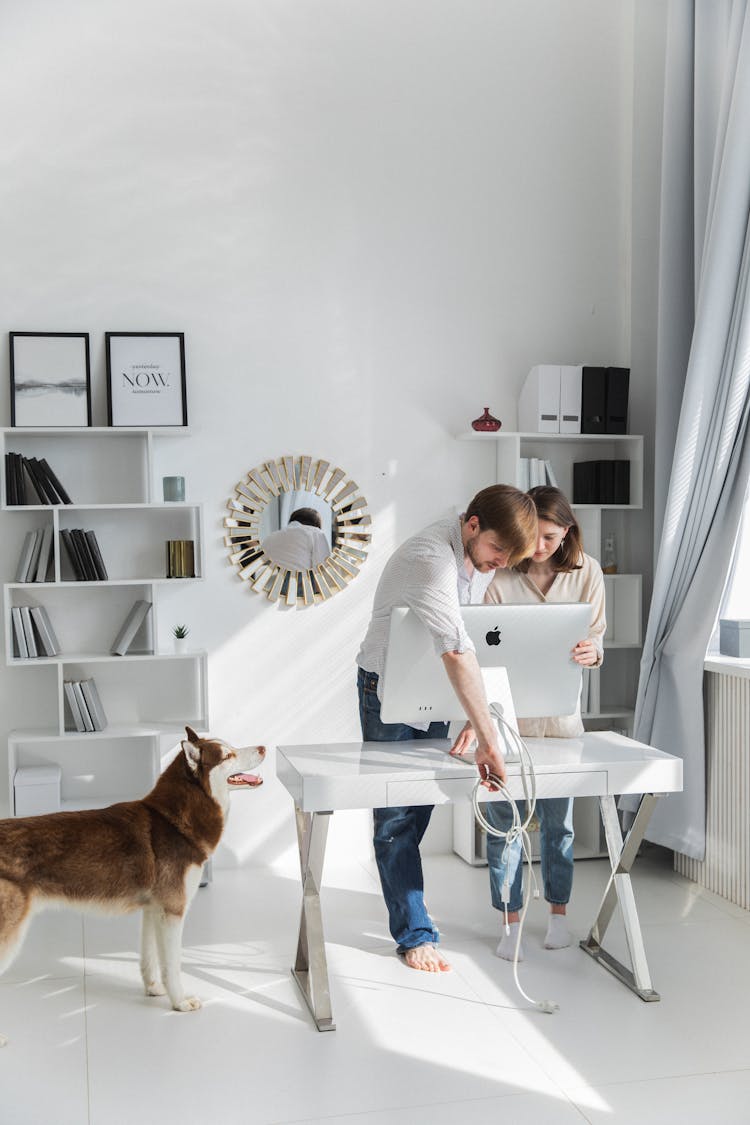 Couple Setting Up New Computer