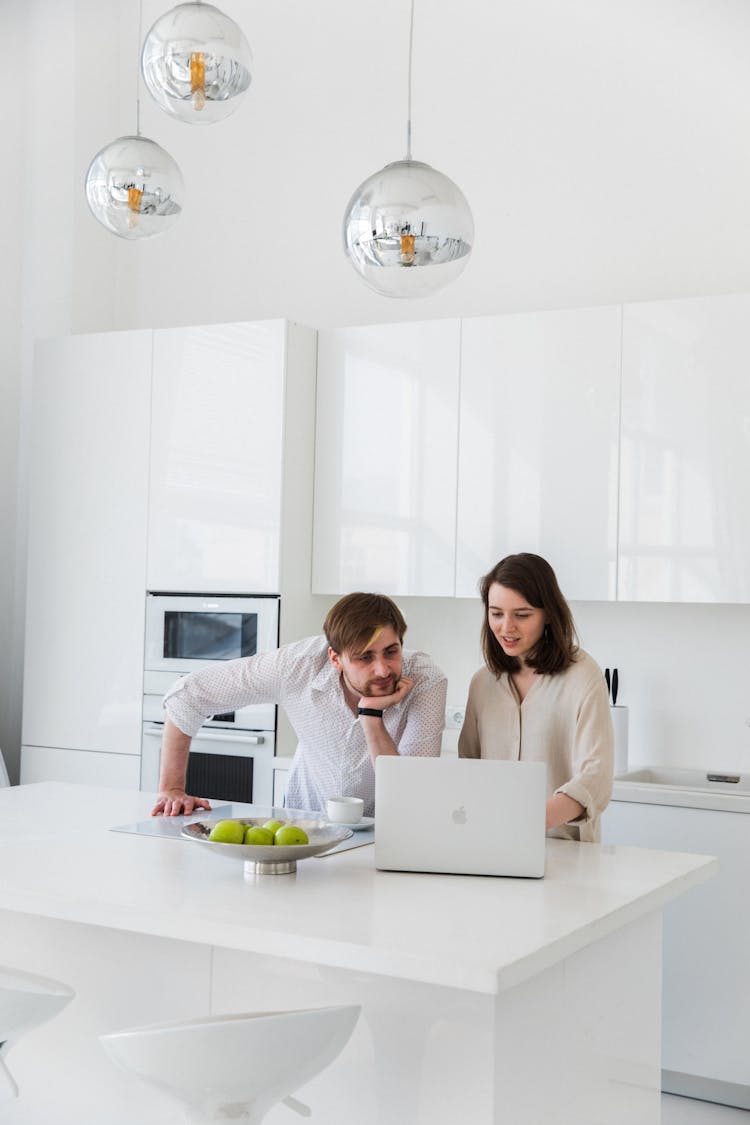 Couple Looking At Laptop