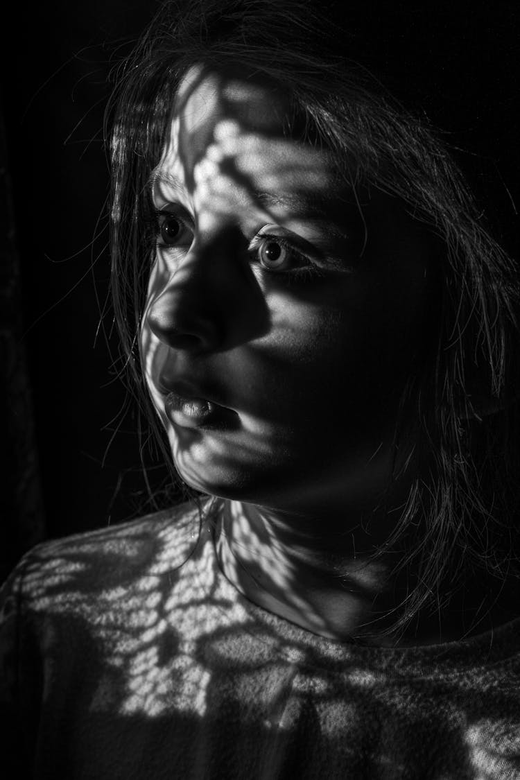 Young Girl With Shadow On Face