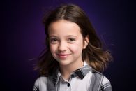 Grinning young girl with fluttering hair