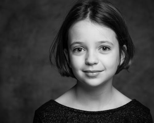 Grayscale Photo of Girl in Black Crew Neck Shirt