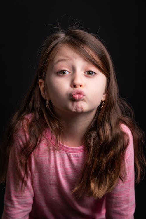 Free Girl in Pink Long Sleeves Pouting Stock Photo
