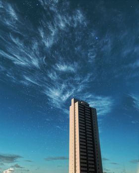 一座高大的现代建筑矗立在繁星点点的夜空中