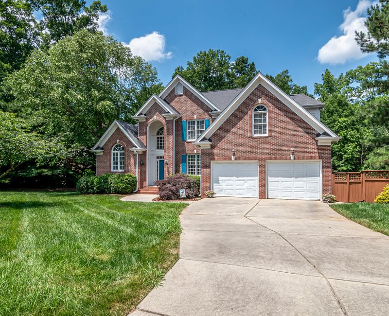 A well-maintained front yard and entrance of a Louisville home
