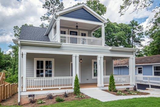 A beautiful suburban home featuring classic architecture and a well-maintained front yard.