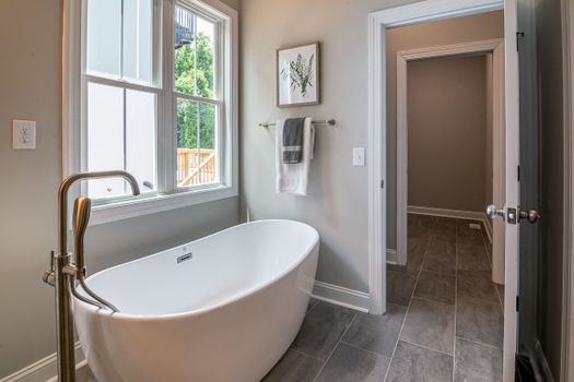 Stylish bathroom featuring a freestanding bathtub and elegant interior design.