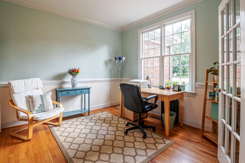 two tone office wall painted light on top and darker below chair rail