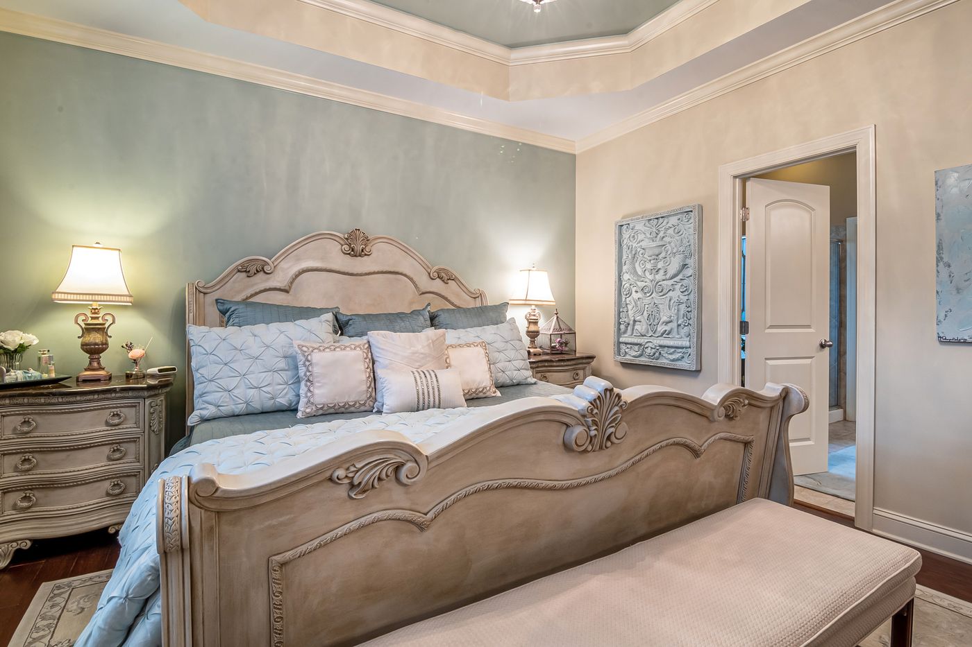 Comfortable bed with fresh bedding in a bright bedroom