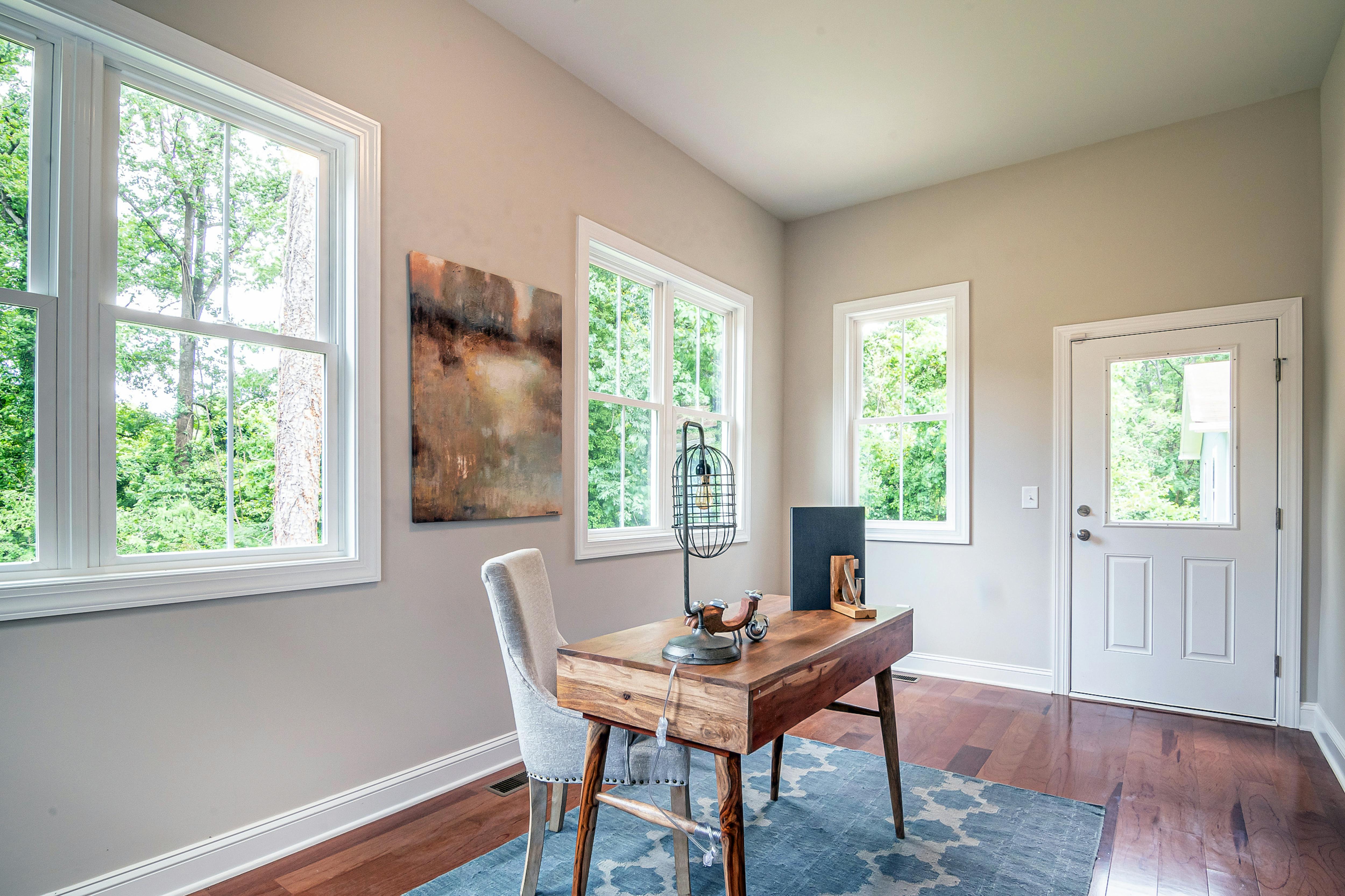 Compact home office space with custom wooden desk and ergonomic chair
