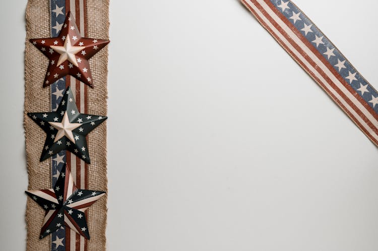 Army Stars On Piece Of Fabric Near American Flag