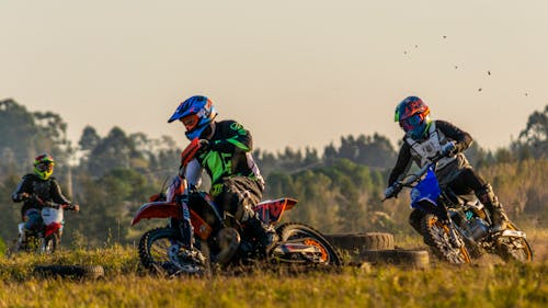 Men Riding Motocross Dirt Bikes