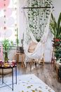 White Hammock Hanged on Green Plant