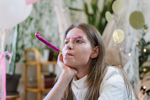 Girl in White Shirt Holding Pink Straw