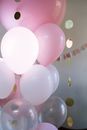 Pink and White Balloons on Ceiling