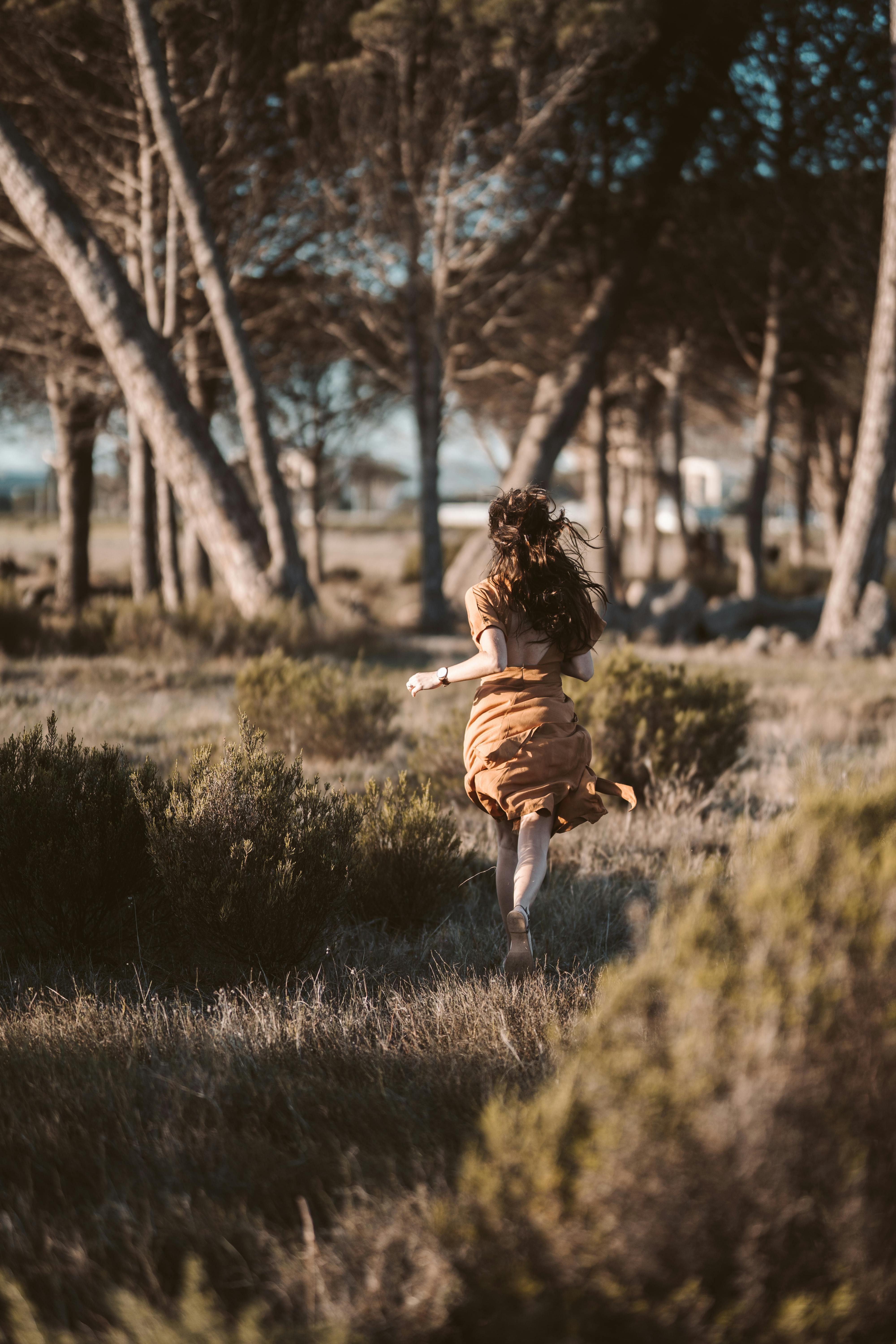 Side View Of Running Woman In Dress. Beautiful Redhead Girl In Motion. Back  Side View Of Person. Rear View People Collection. Isolated Over White  Background. A Girl In A Short Skirt Rushing