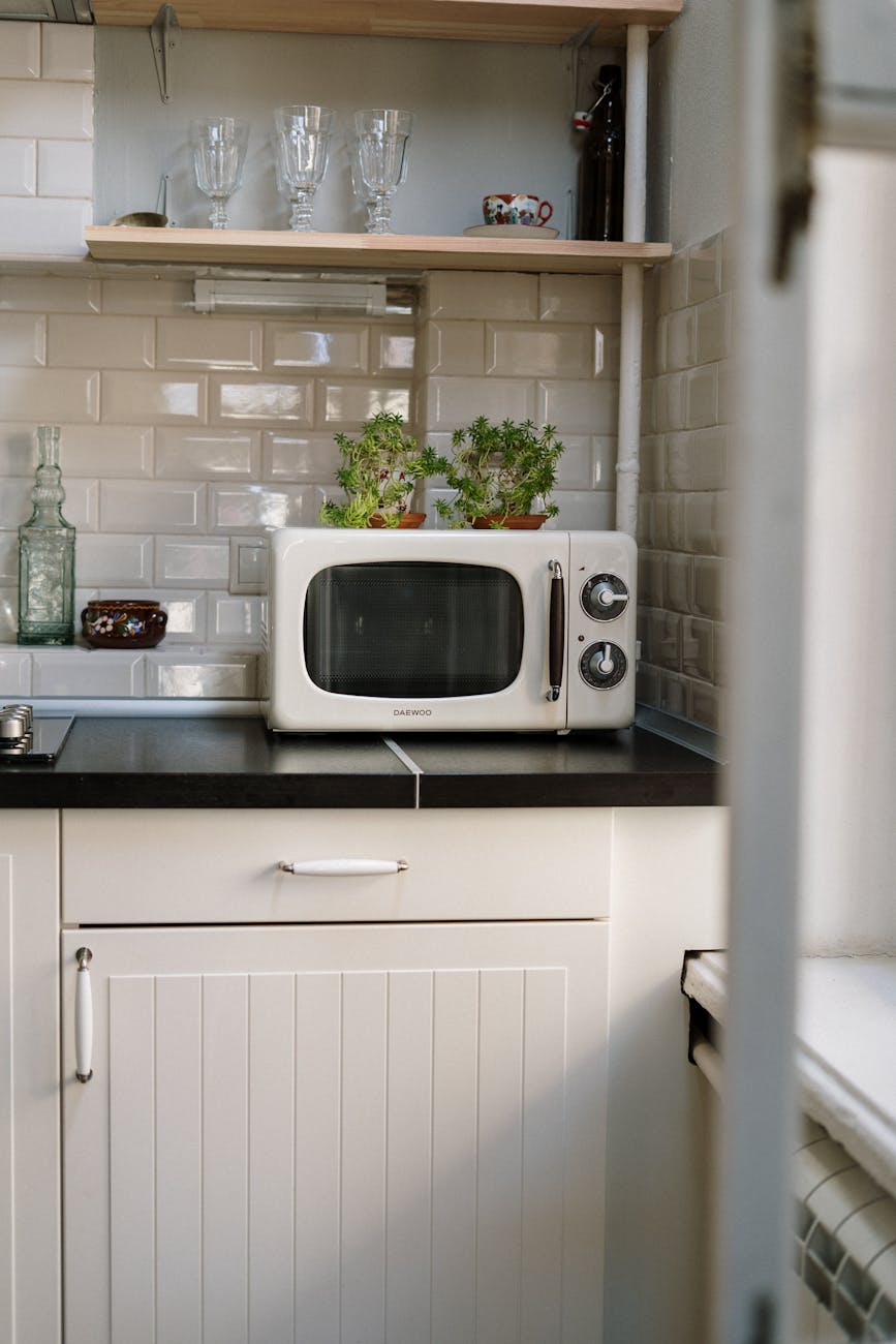 a picture of kitchen with microwave